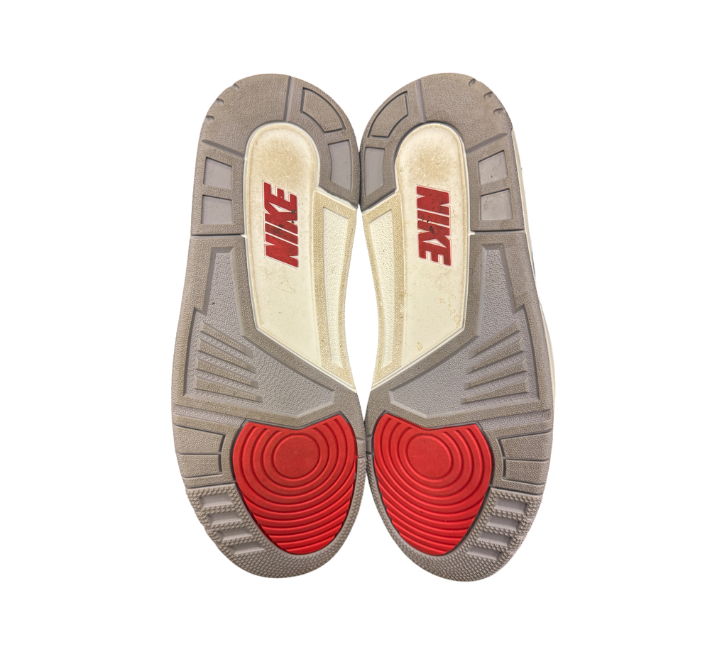 Genesis Boutique used Jordan 3 Black Cement sneakers showing grey and red rubber outsoles with Nike branding
