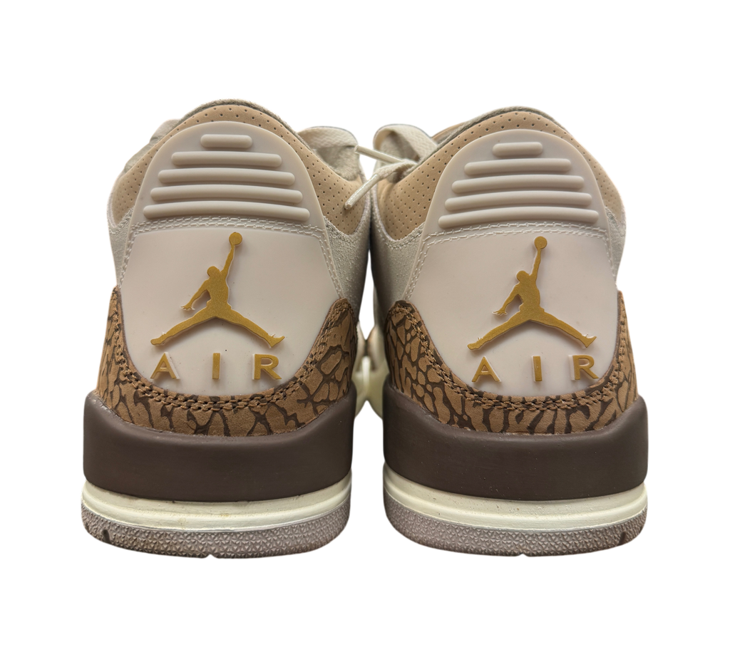 Genesis Boutique Jordan 3 Palomino sneakers showing the heel view with gold Jumpman logos and brown elephant print.