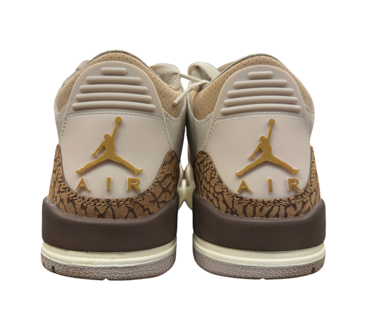 Genesis Boutique Jordan 3 Palomino sneakers showing the heel view with gold Jumpman logos and brown elephant print.