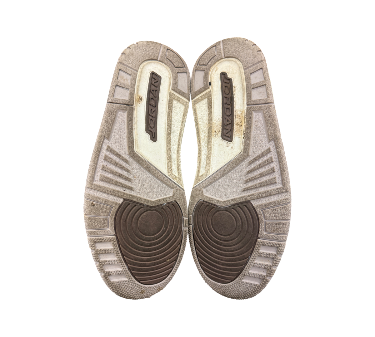 Genesis Boutique used Jordan 3 Palomino sneakers showing the brown and beige rubber outsoles with Jordan branding