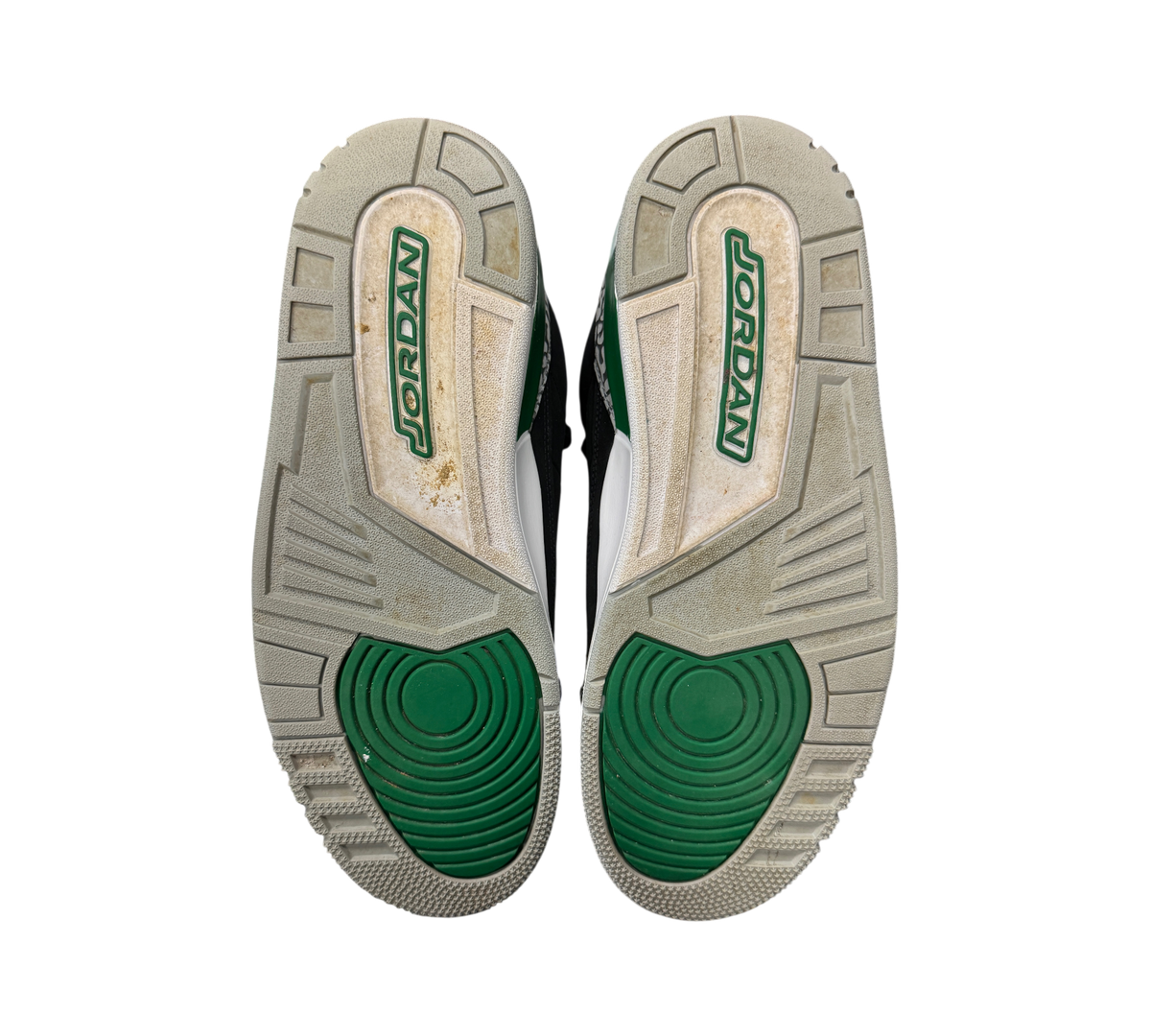 Genesis Boutique used Air Jordan 3 Pine Green sneakers showing the green and grey rubber outsoles from below