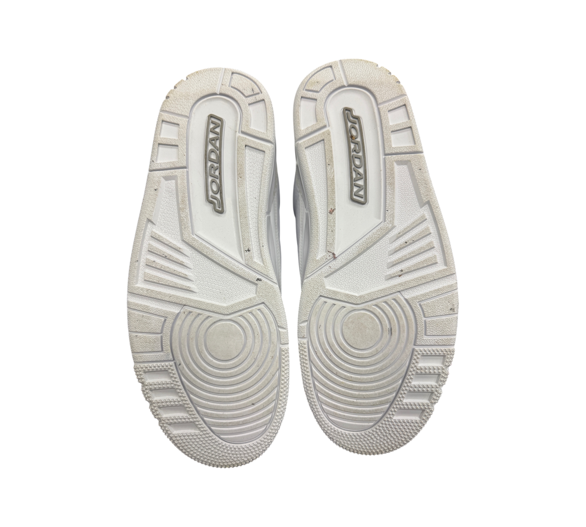 Genesis Boutique Jordan 3 Pure Money sneakers showing the white rubber outsoles with Jordan branding