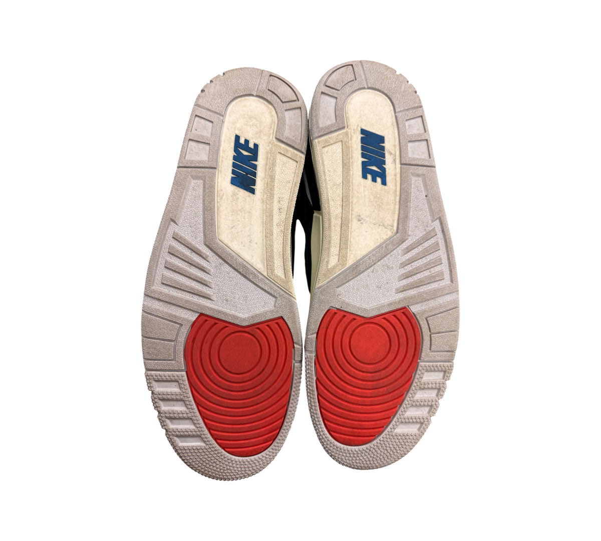 Genesis Boutique Jordan 3 Rare Air sneakers with red and white soles and blue Nike logos.
