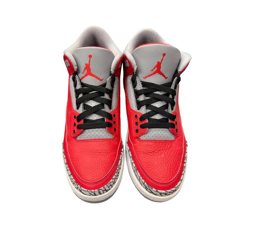 Genesis Boutique pre-owned Jordan 3 Unite Red Cement sneakers with red leather, grey tongues, and elephant print trim.