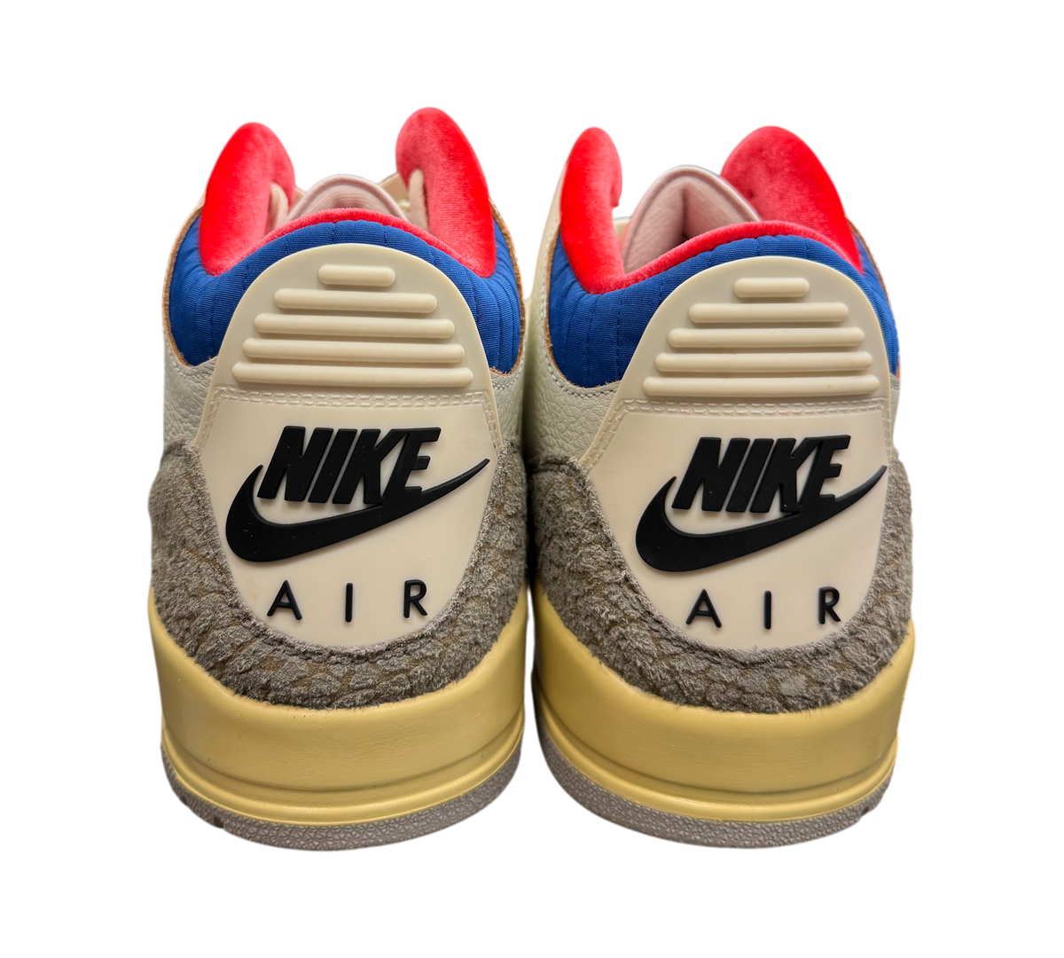 Genesis Boutique Jordan 3 "Seoul 2.0" sneakers with cream, blue, and red accents. Textured grey heel.
