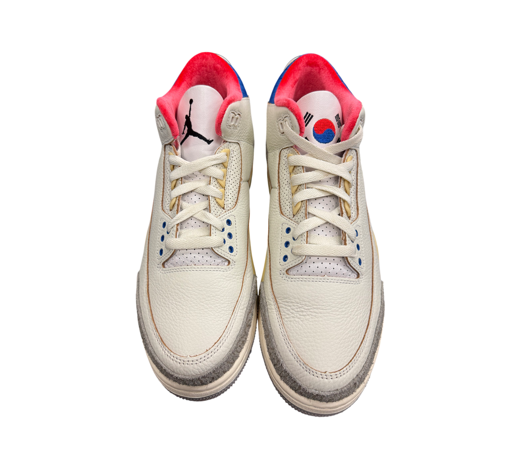Genesis Boutique Jordan 3 "Seoul 2.0" sneakers in off-white leather with red and blue accents. Features Korean flag detail.