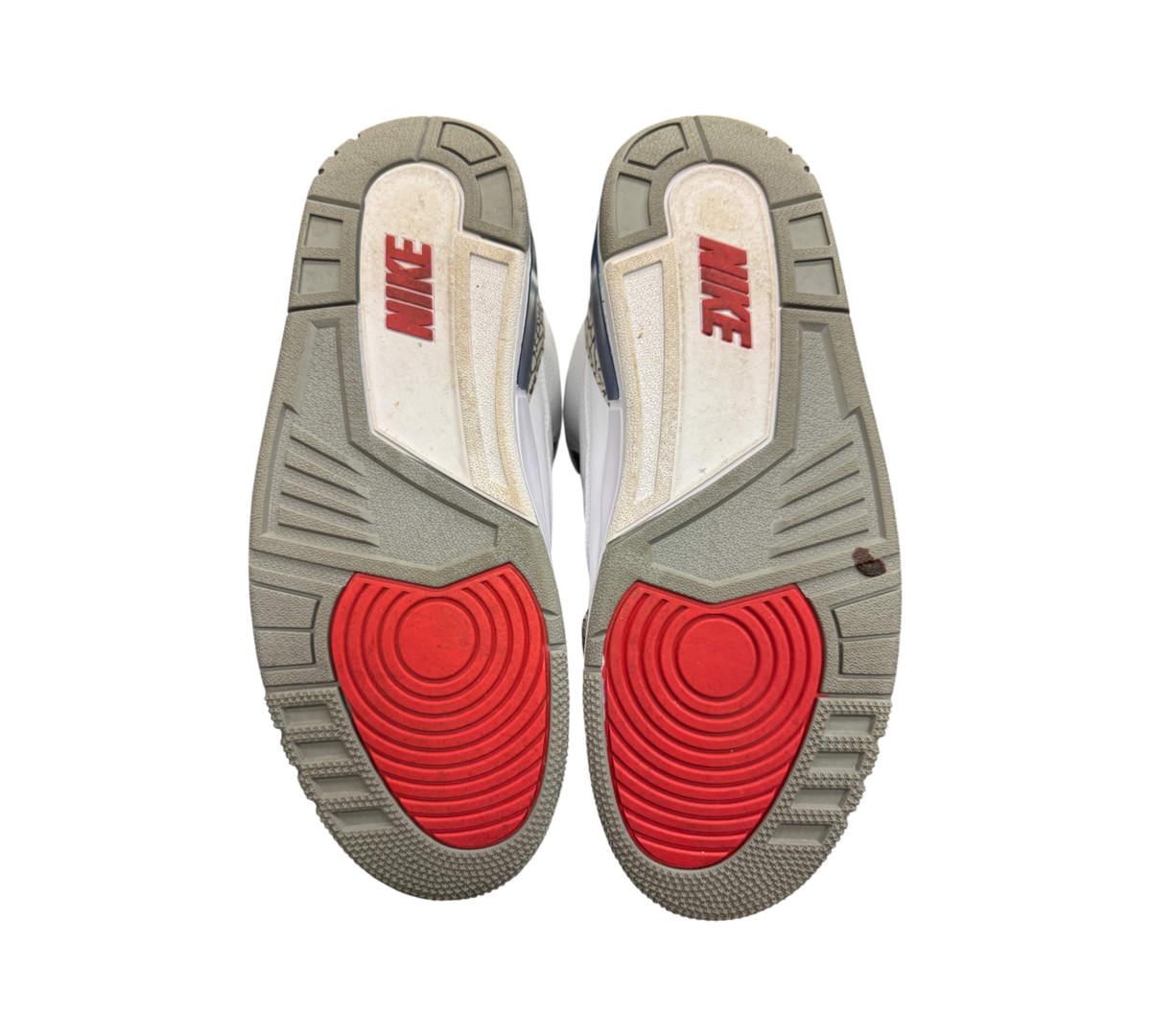 Genesis Boutique Jordan 3 True Blue 2016 sneaker outsoles showing red and grey rubber tread patterns