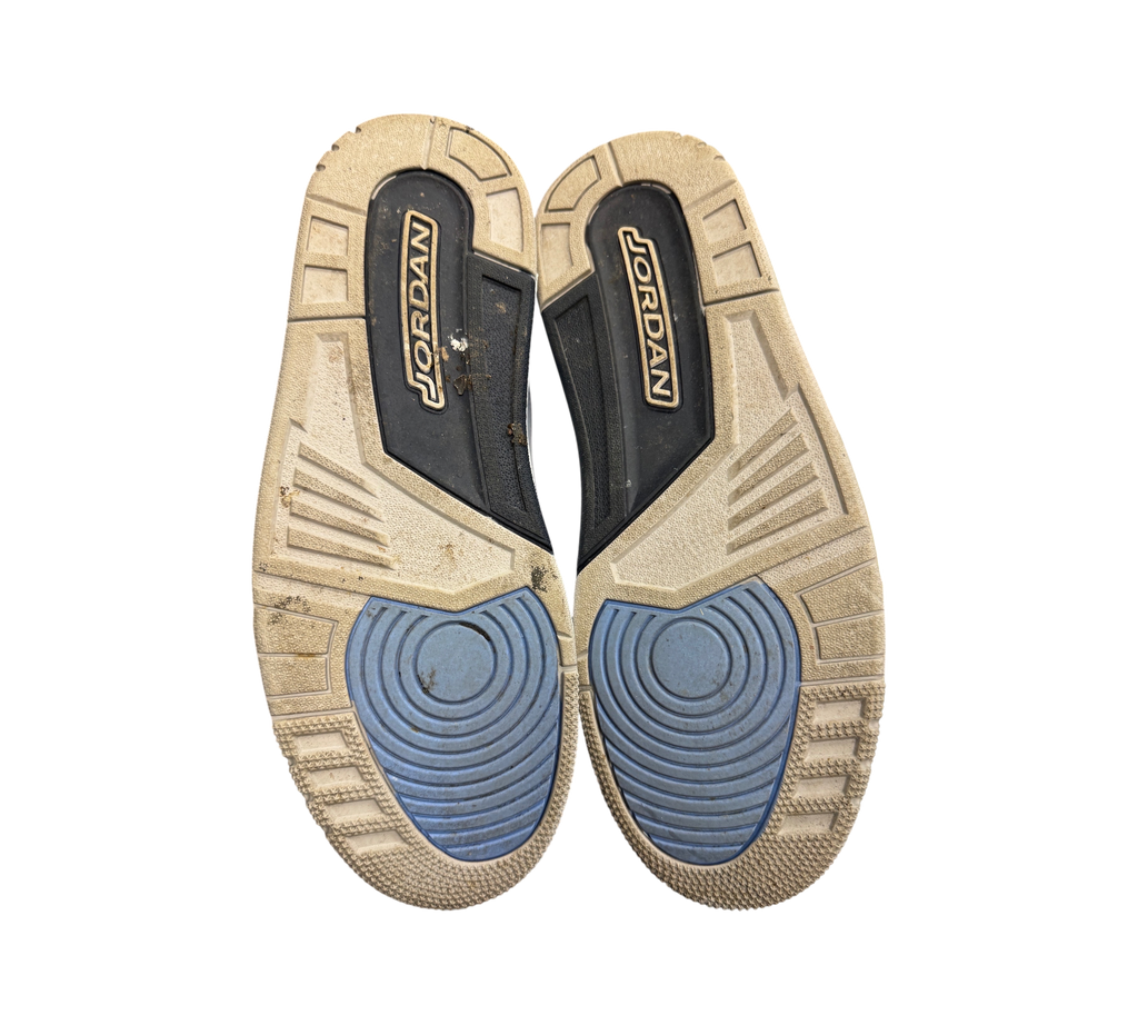 Genesis Boutique used Jordan 3 UNC sneakers showing the worn rubber outsoles with blue and grey traction patterns