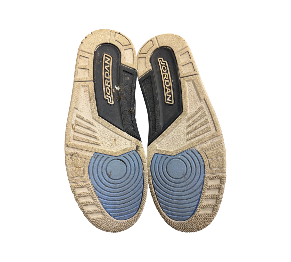 Genesis Boutique used Jordan 3 UNC sneakers showing the worn rubber outsoles with blue and grey traction patterns