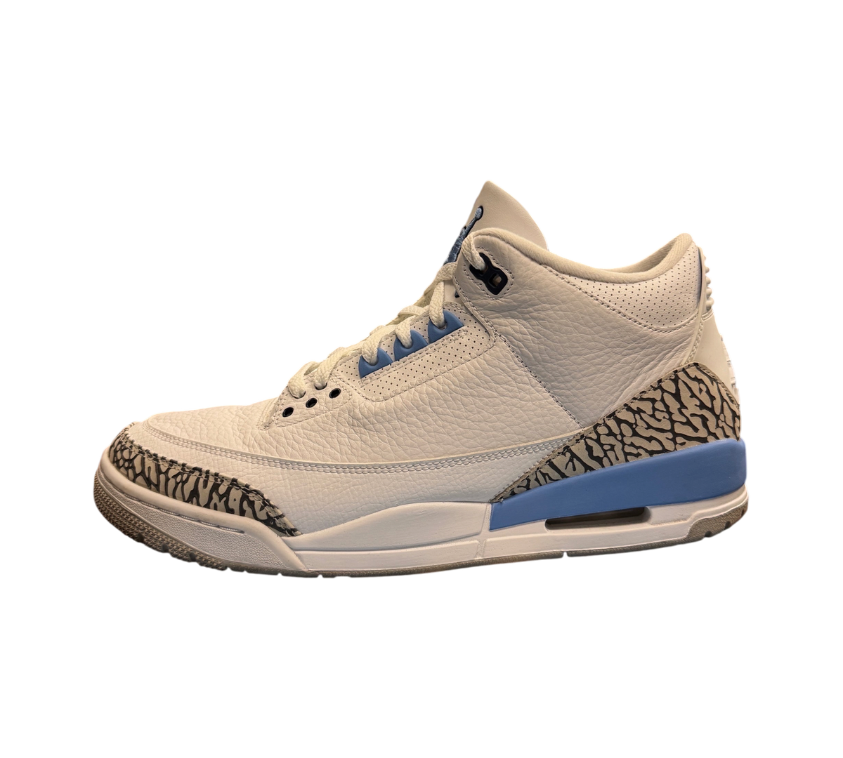 Genesis Boutique Jordan 3 UNC sneakers in white leather with iconic elephant print and university blue accents.