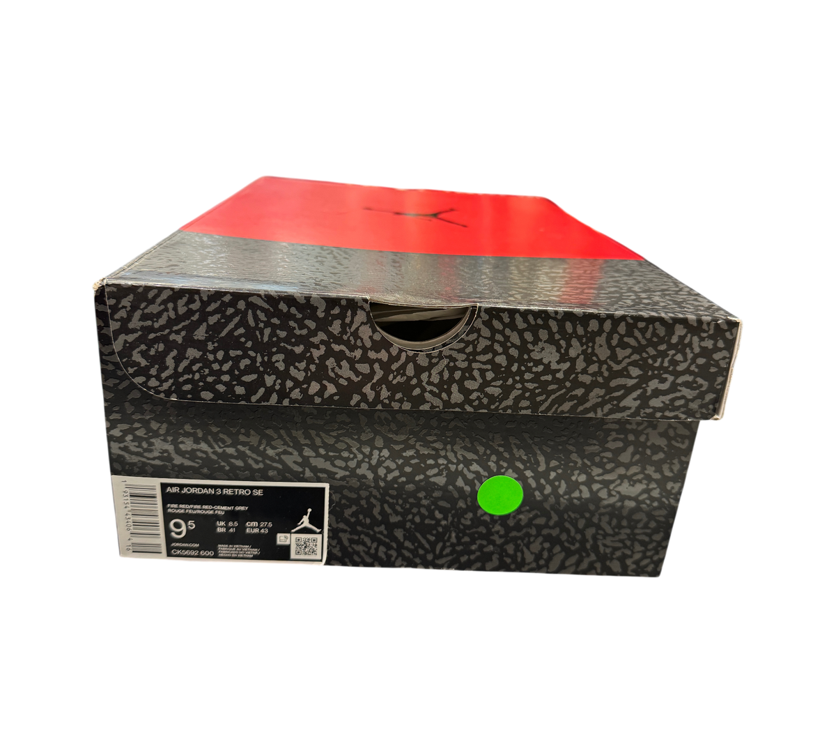 Genesis Boutique Jordan 3 Unite Red Cement sneaker box with iconic elephant print and red lid in a retail store