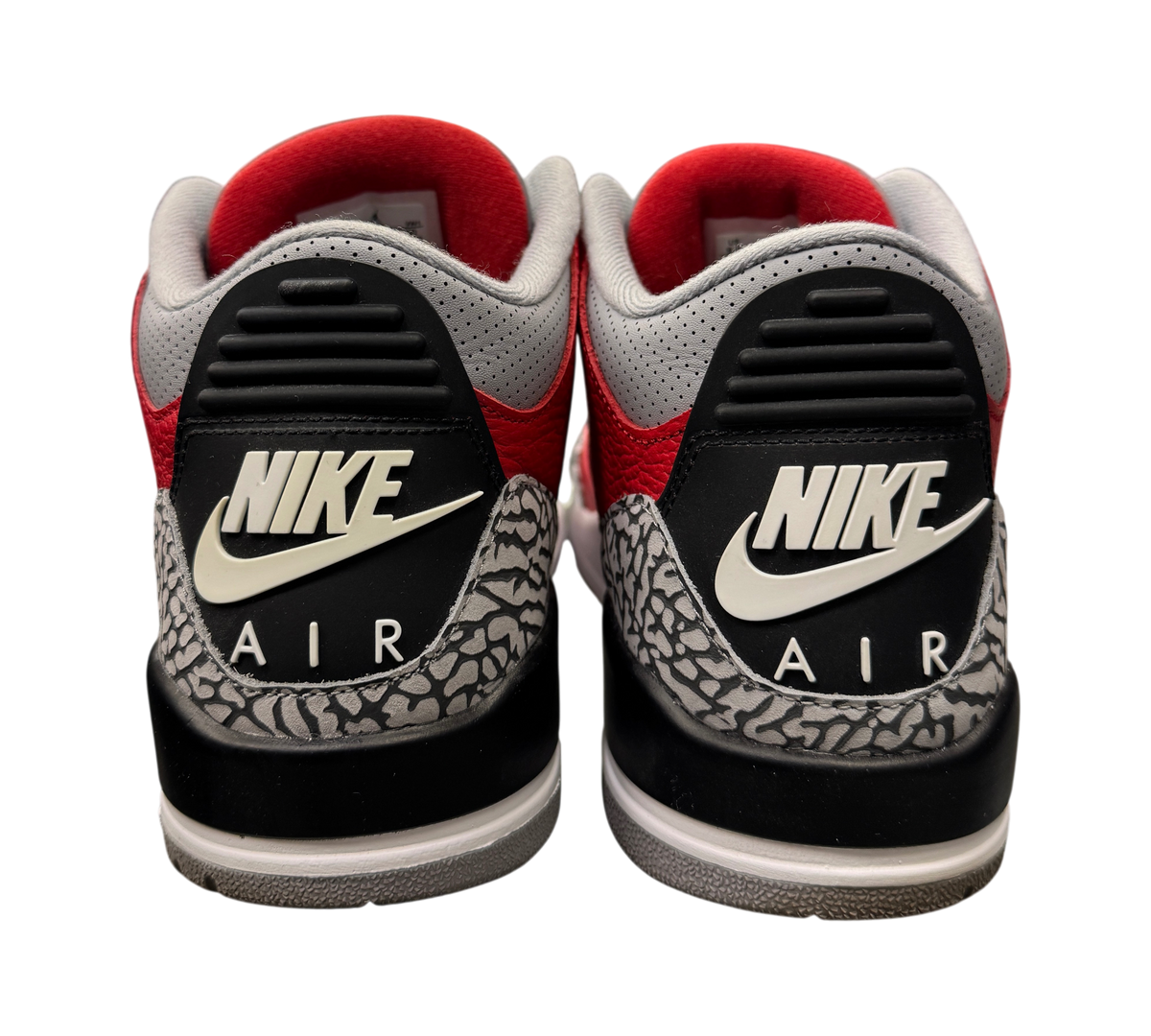 Back view of Genesis Boutique used Jordan 3 Unite Red Cement sneakers featuring iconic elephant print and Nike Air logo