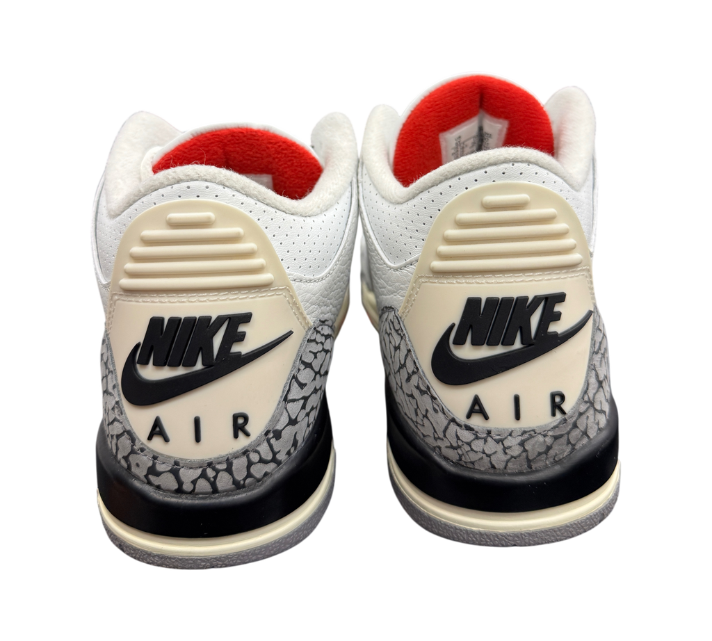 Genesis Boutique Jordan 3 GS White Cement sneakers showing the iconic elephant print heel and Nike Air branding.