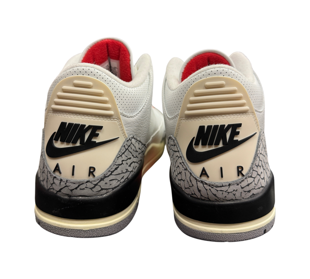 Genesis Boutique Jordan 3 White Cement Reimagined sneakers showing the iconic elephant print heel and Nike Air branding.