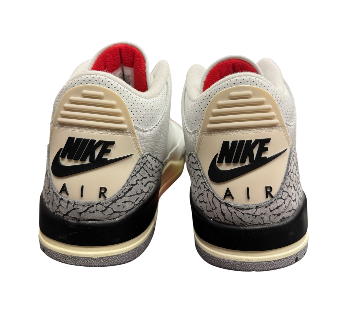 Genesis Boutique Jordan 3 White Cement Reimagined sneakers showing the iconic elephant print heel and Nike Air branding.