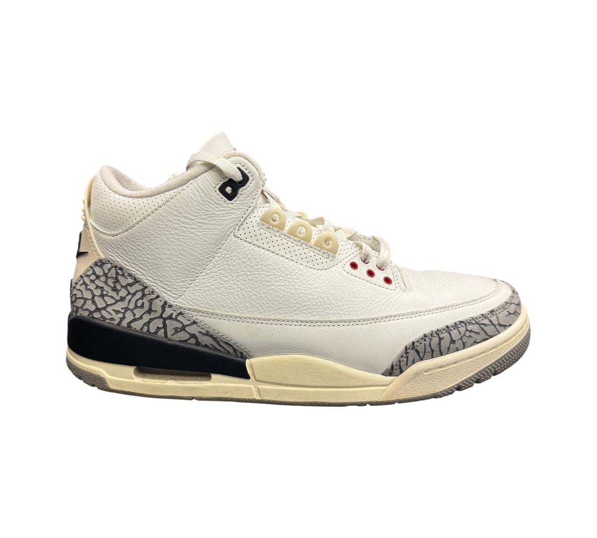 Genesis Boutique Jordan 3 White Cement Reimagined sneakers featuring white leather, grey elephant print, and aged sole.