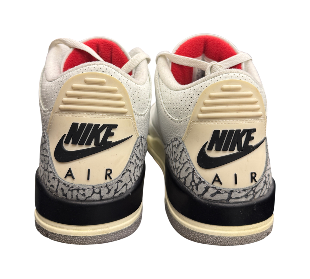 Genesis Boutique used Jordan 3 White Cement Reimagined sneakers featuring iconic elephant print and Nike Air branding.