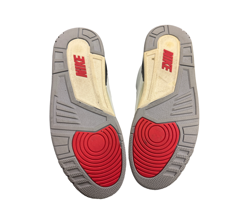 Genesis Boutique used Jordan 3 White Cement Reimagined sneakers showing grey and red rubber outsoles with Nike branding