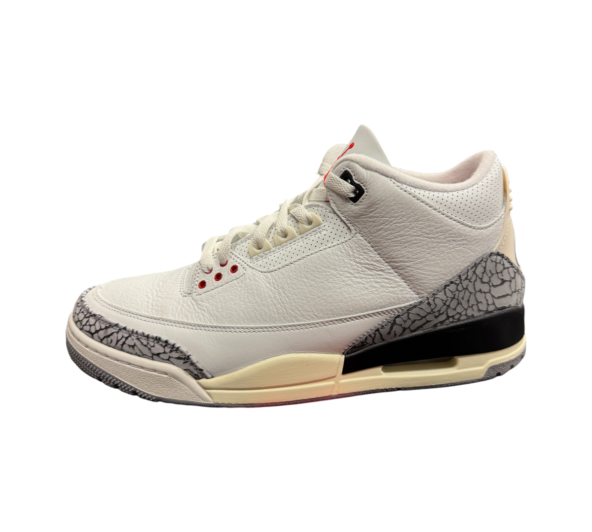 Genesis Boutique Jordan 3 White Cement Reimagined sneakers featuring white leather and iconic grey elephant print.