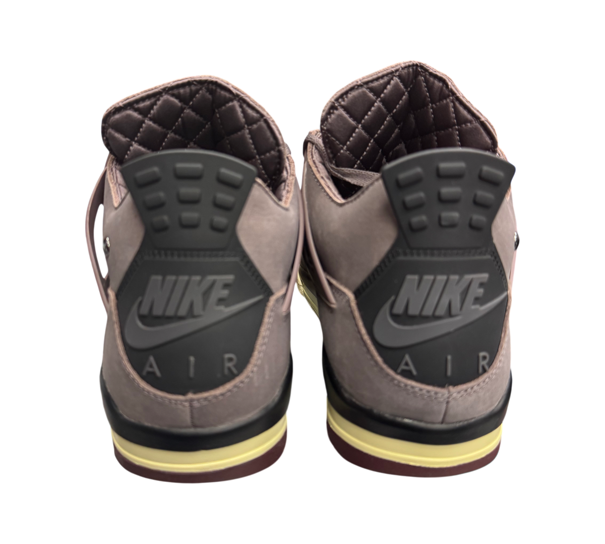 Genesis Boutique Jordan 4 A Ma Maniere sneakers featuring violet suede uppers, black Nike Air heel tabs, and quilted lining