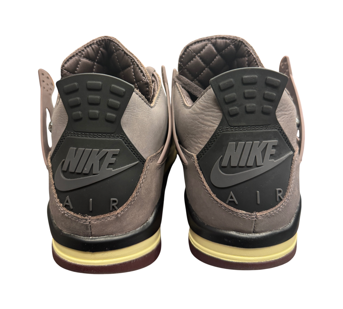 Genesis Boutique used Jordan 4 A Ma Violet Ore sneakers showing the back heel tabs with Nike Air branding