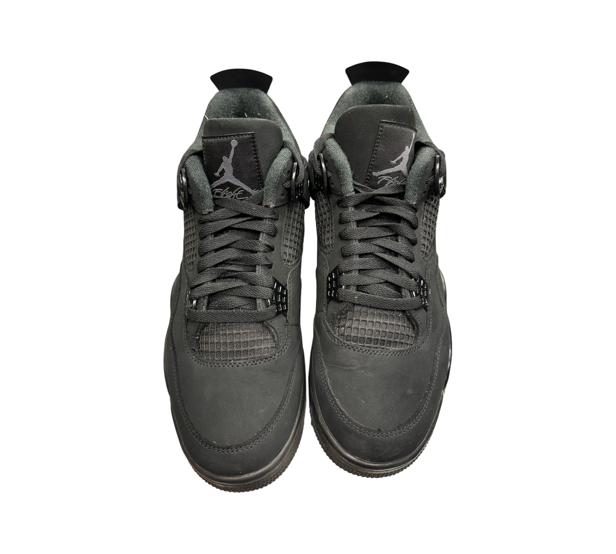 Genesis Boutique used Jordan 4 Black Cat sneakers in all-black nubuck with matching laces and Jumpman tongue branding.