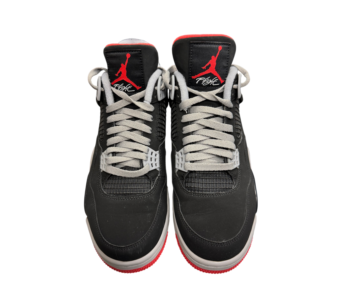 Genesis Boutique Jordan 4 "Bred" 2019 sneakers with black uppers, red accents, and grey laces.