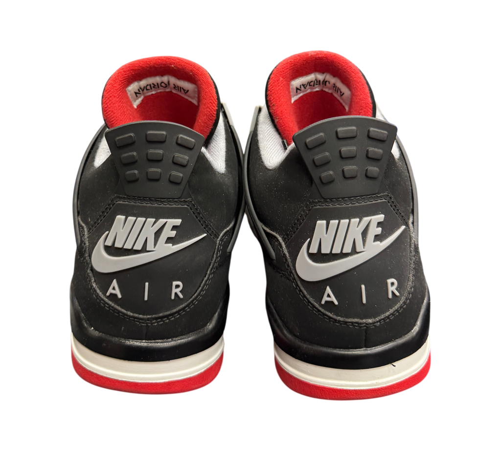Genesis Boutique Jordan 4 2019 Bred sneakers featuring black nubuck, red accents, and Nike Air heel branding.
