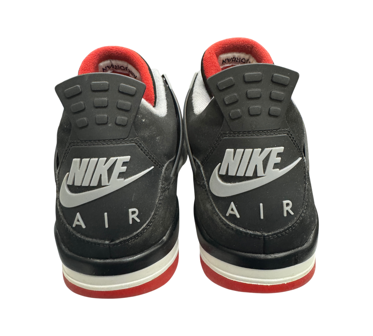 Genesis Boutique Jordan 4 Bred 2019 sneakers showing black nubuck heels with grey Nike Air branding and red accents