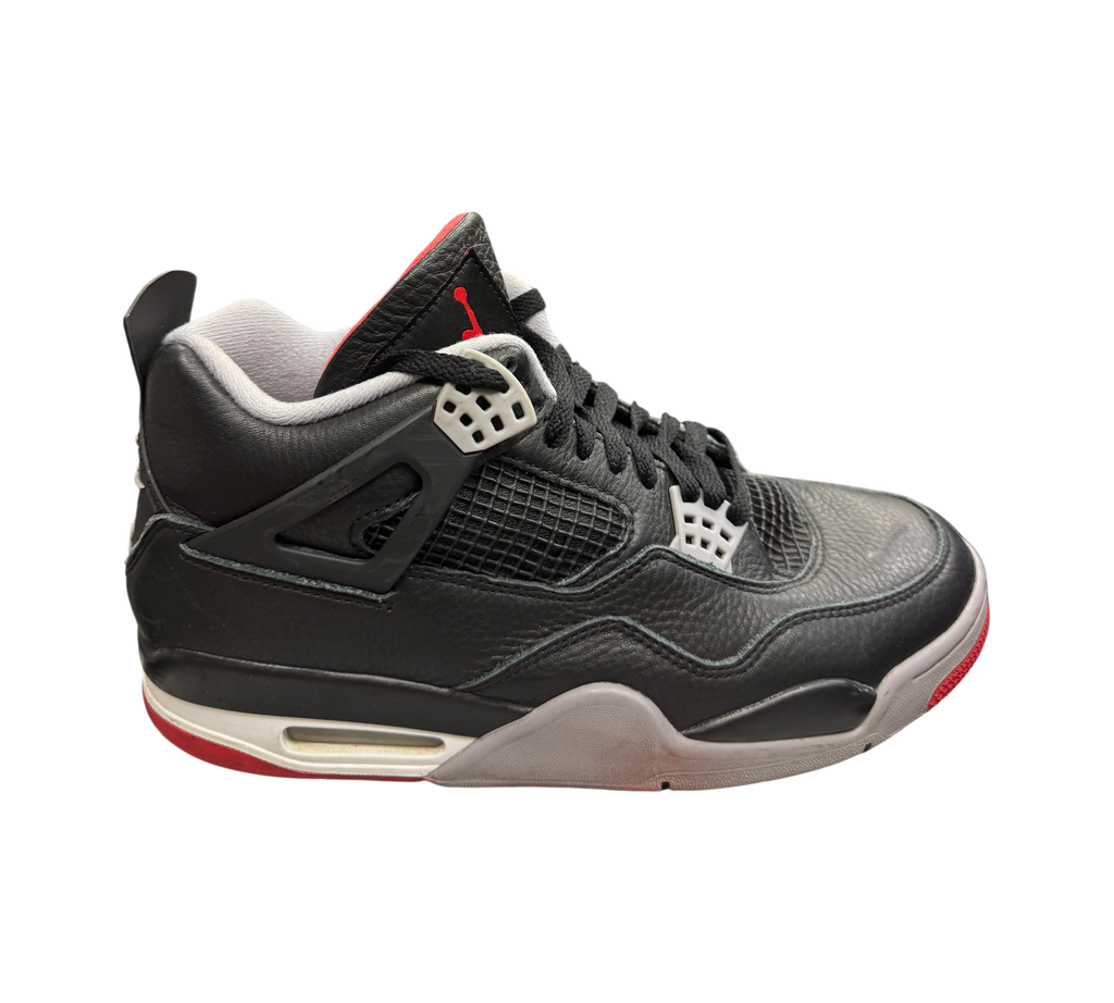 Genesis Boutique Jordan 4 Bred Reimagined sneakers in black leather with red accents and grey midsole details.