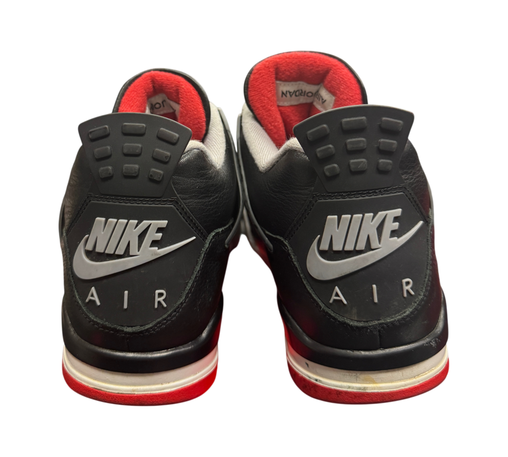 Genesis Boutique Jordan 4 Bred Reimagined sneakers showing black leather heels with Nike Air branding and red accents