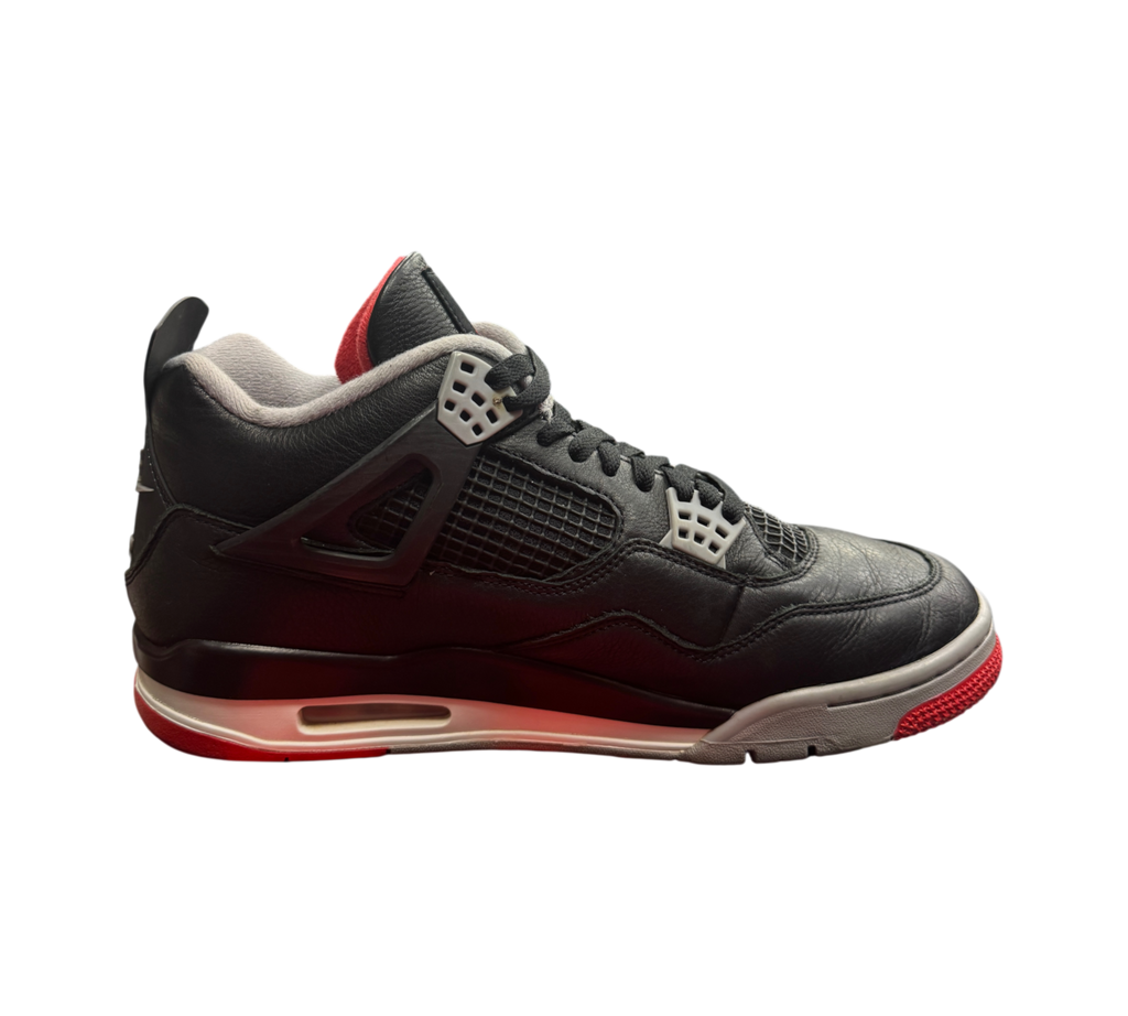 Genesis Boutique Jordan 4 Bred Reimagined sneakers in black leather with red and grey accents, side profile view.