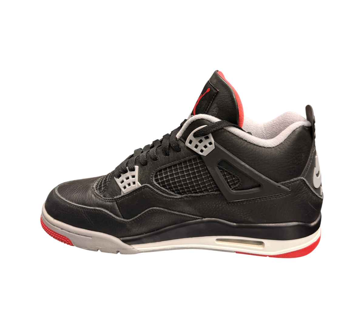 Genesis Boutique Jordan 4 Bred Reimagined sneakers in black leather with red and grey accents. SKU FV5029-006.