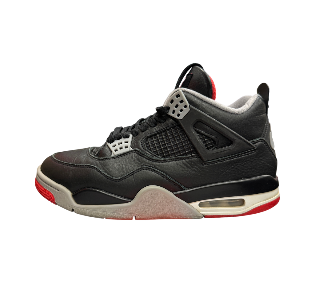 Genesis Boutique Jordan 4 Bred Reimagined sneakers in black leather with grey and red accents on a speckled box