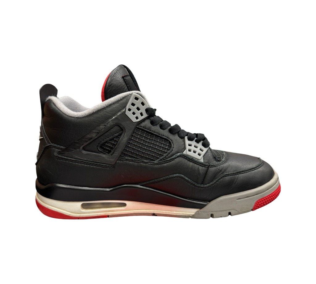 Genesis Boutique Jordan 4 Bred Reimagined sneakers in black leather with grey and red accents on a branded shoebox