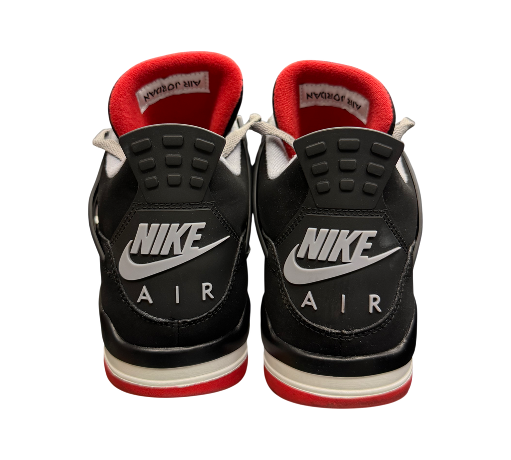 Genesis Boutique Jordan 4 "Bred" 2019 sneakers with black, red, and white accents. Features Nike Air branding.