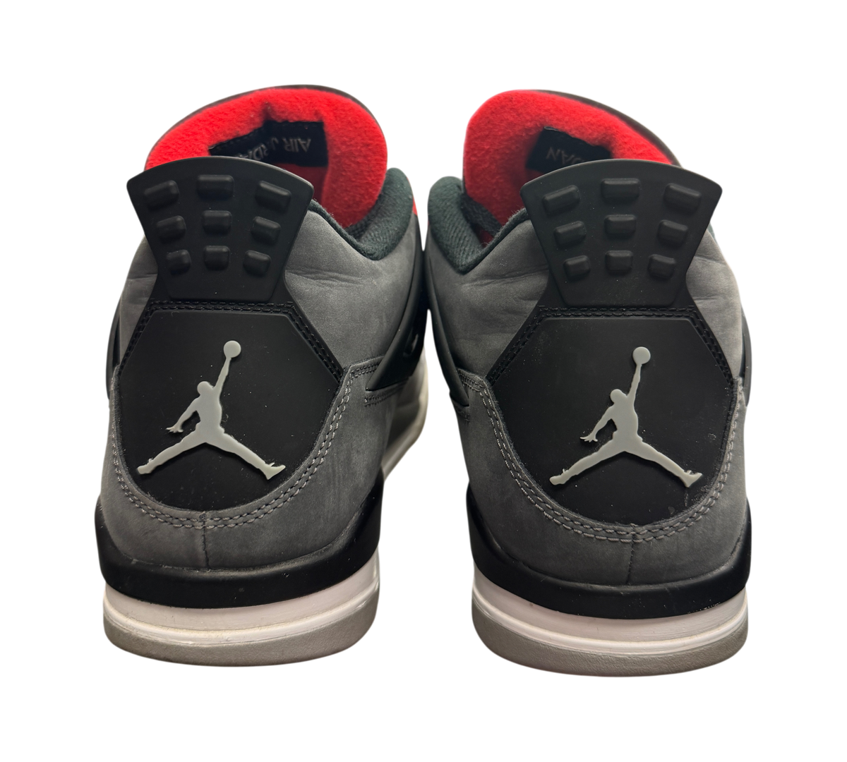 Genesis Boutique used Jordan 4 Infrared sneakers showing grey nubuck heels with Jumpman logos and red inner lining