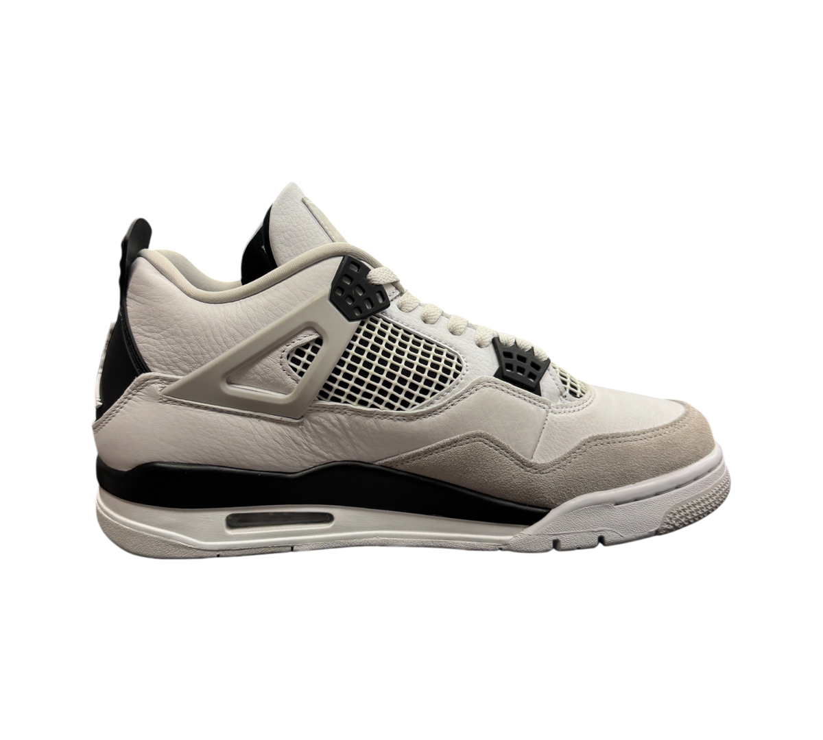 Genesis Boutique Jordan 4 Military Black sneakers featuring a white leather upper, grey suede toe, and black accents.