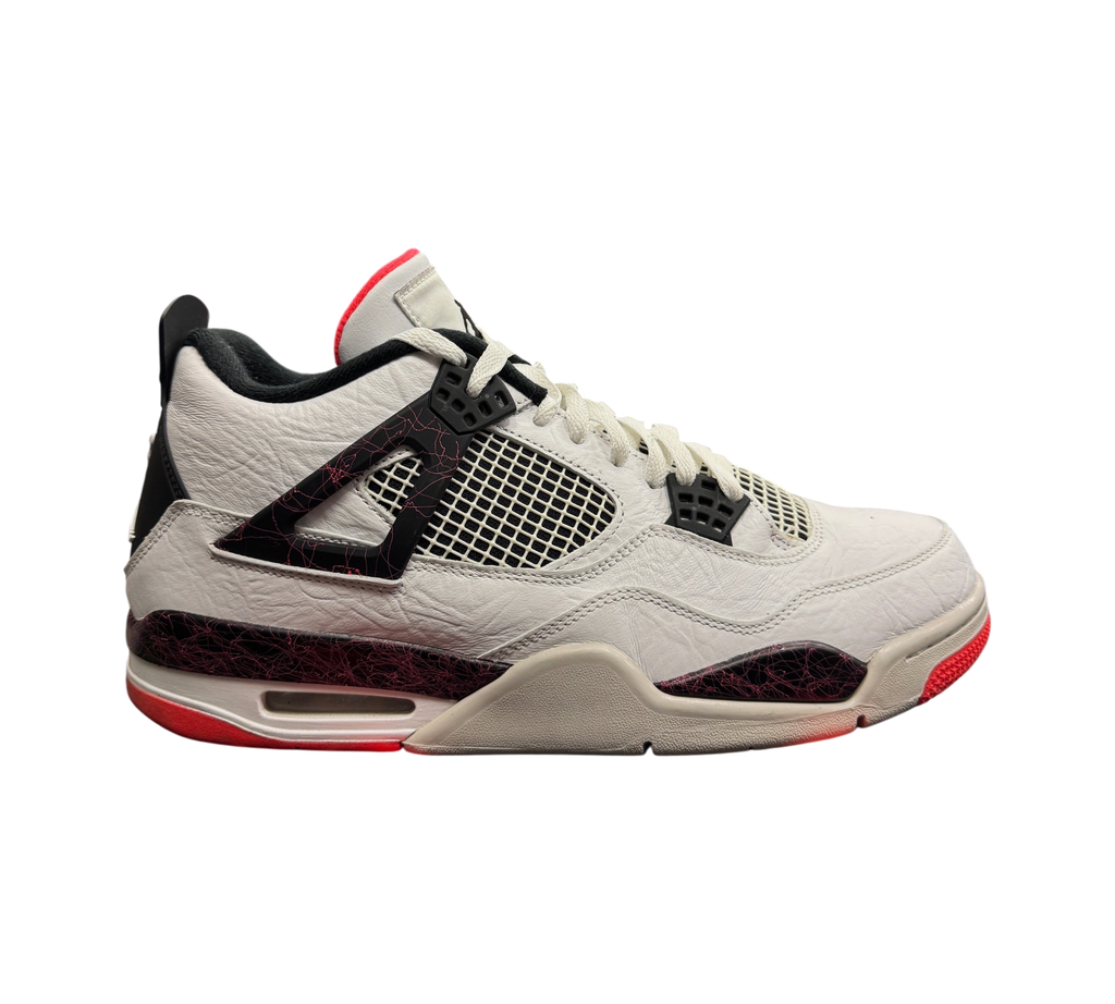 Genesis Boutique Jordan 4 Pale Citron sneakers in white leather with black and red splatter details on a store display