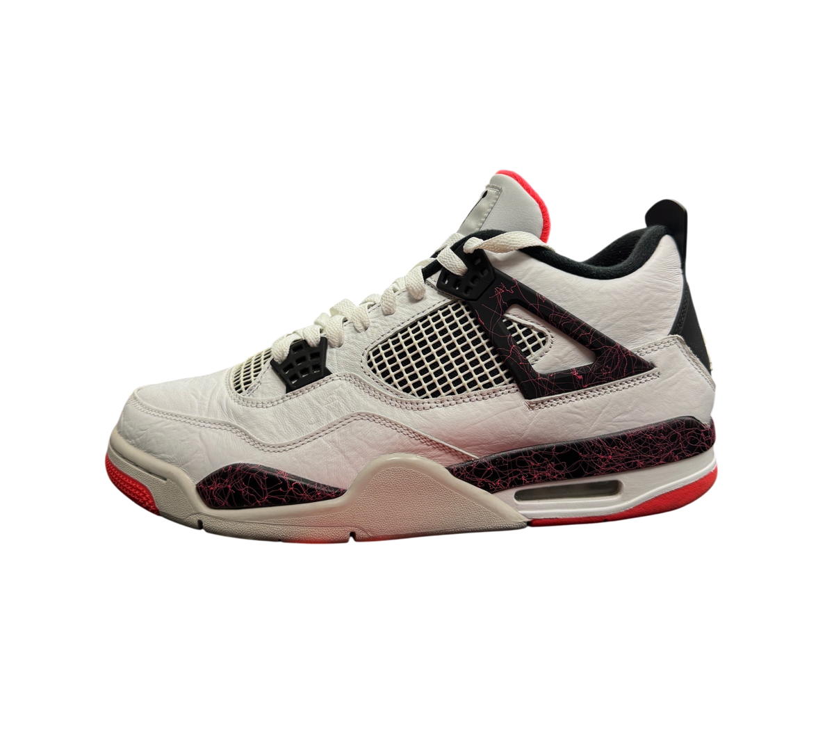 Genesis Boutique Jordan 4 Pale Citron sneakers in white leather with black and red splatter details on a shoe box
