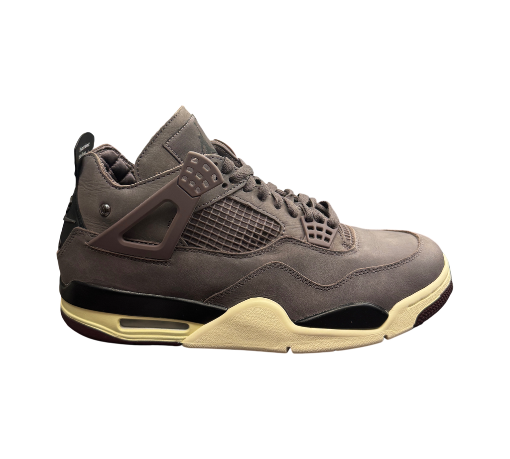 Genesis Boutique Jordan 4 A Ma Maniere Violet Ore sneakers in dark purple nubuck with cream midsole in retail store.