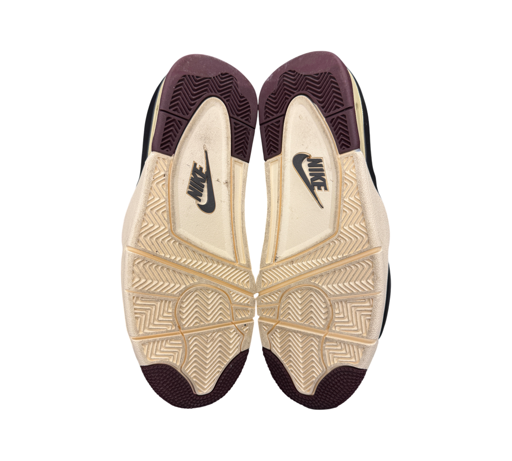 Genesis Boutique Jordan 4 A Ma Maniere Violet Ore sneaker outsoles showing cream and burgundy tread pattern