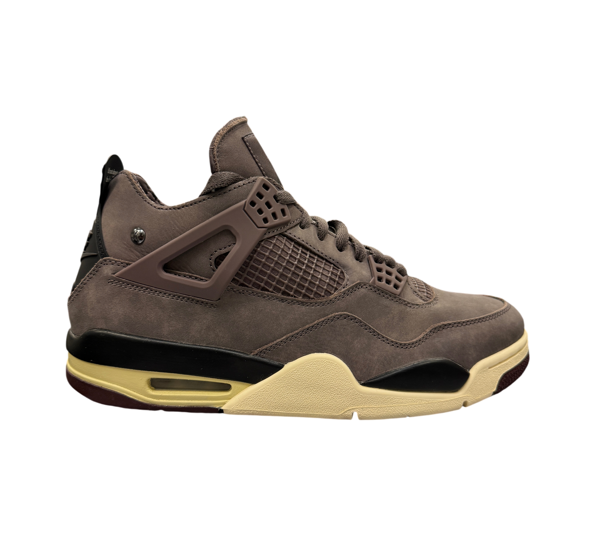 Genesis Boutique Jordan 4 A Ma Maniere Violet Ore sneaker in dark purple suede with cream midsole and black accents.
