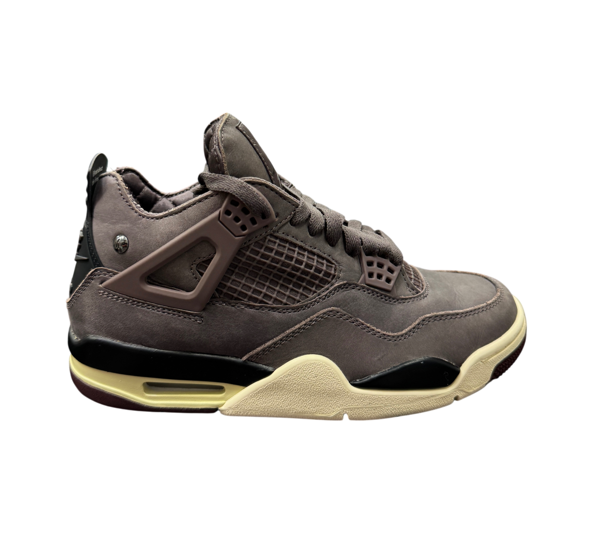 Genesis Boutique Jordan 4 A Ma Maniere Violet Ore sneakers in dark purple suede with cream and black midsole details.