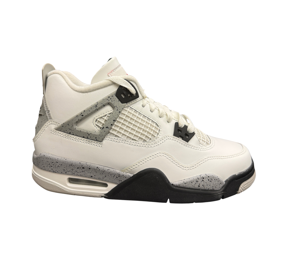 Genesis Boutique Jordan 4 GS White Cement sneakers featuring white leather upper and iconic grey speckled detailing.