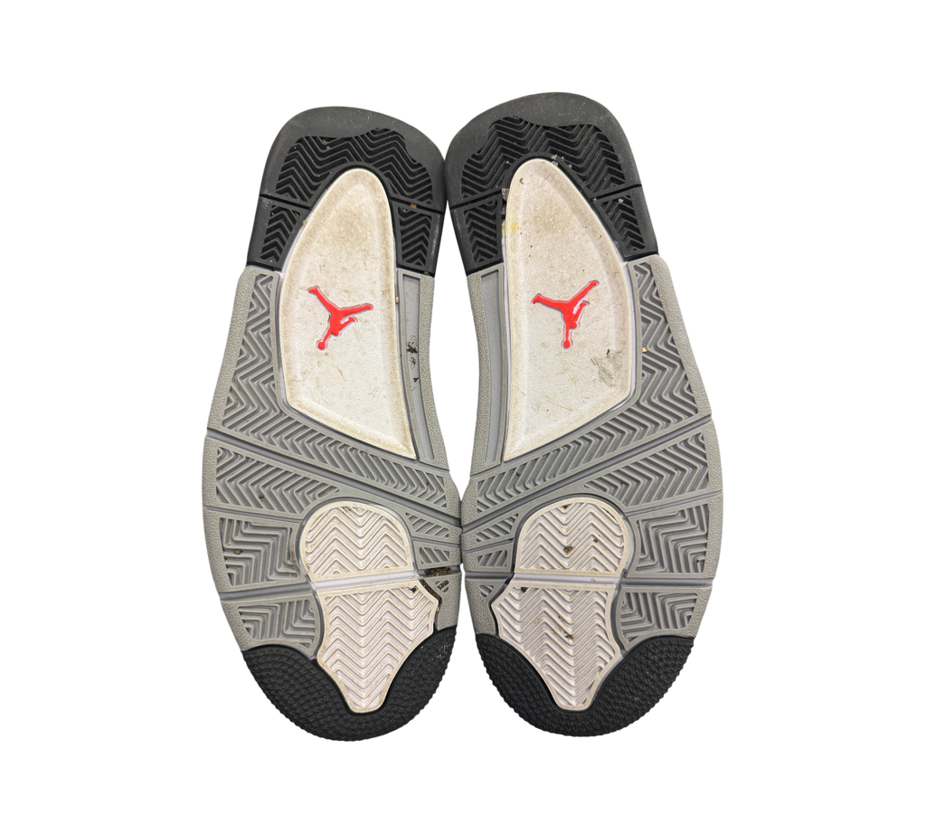 Genesis Boutique used Jordan 4 Zen Master sneakers showing the grey and black rubber outsoles with red Jumpman logos