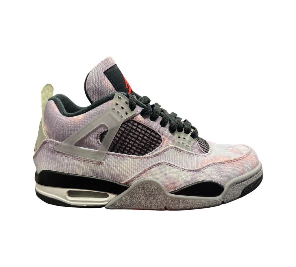Genesis Boutique Jordan 4 Zen Master sneakers featuring a purple and pink tie-dye canvas upper with black accents.