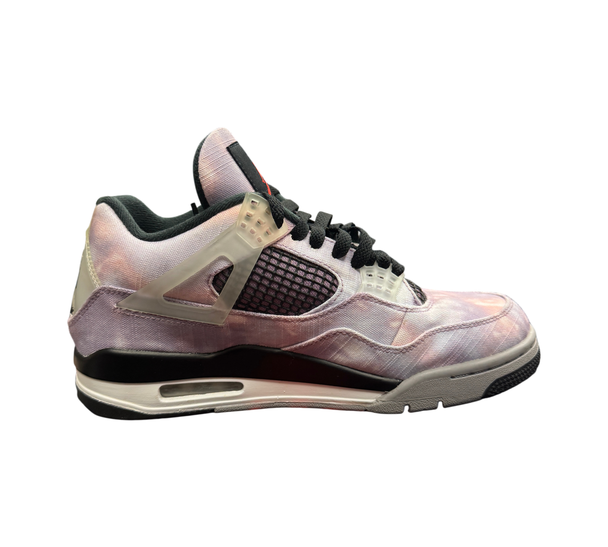 Genesis Boutique Jordan 4 Zen Master sneaker featuring a purple and pink tie-dye canvas upper and translucent wings.
