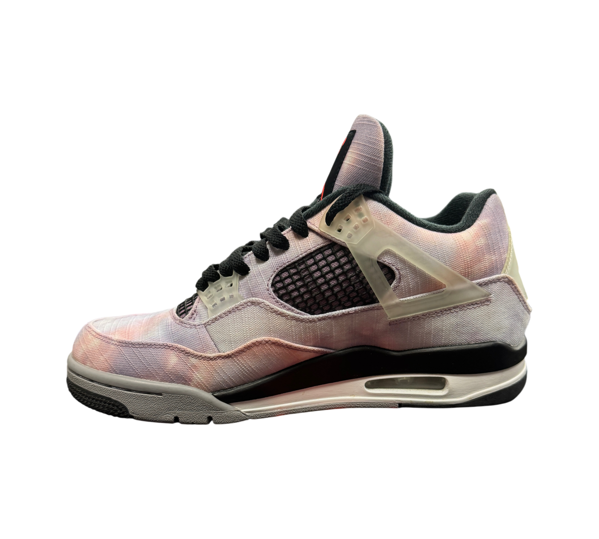 Genesis Boutique Jordan 4 Zen Master sneaker featuring a purple and pink tie-dye canvas upper with black accents