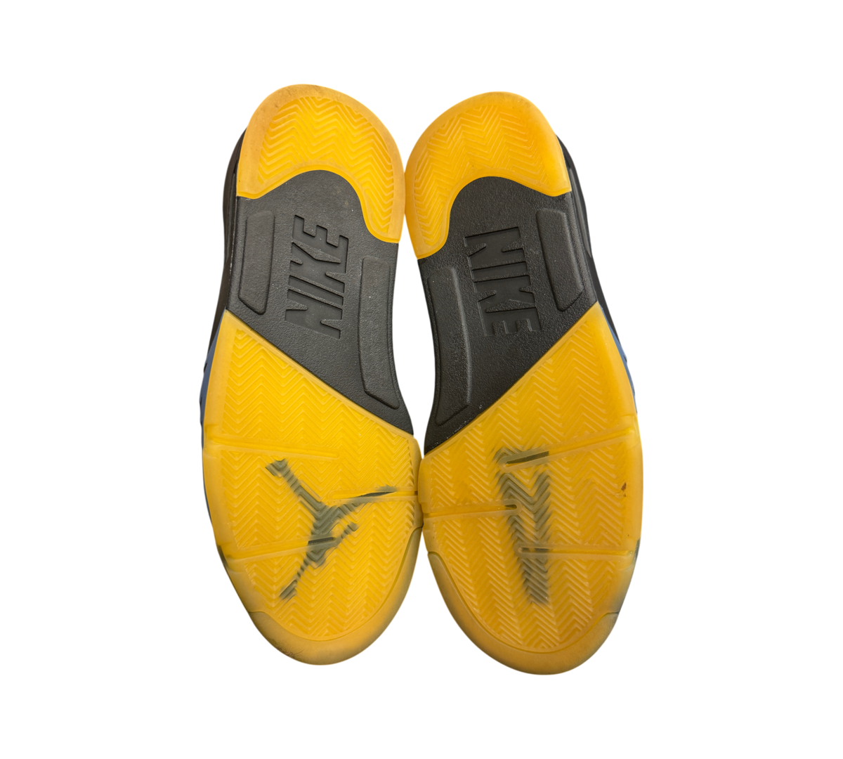 Genesis Boutique Jordan 5 A Ma Maniere Dawn sneakers showing the yellow translucent and black rubber outsoles